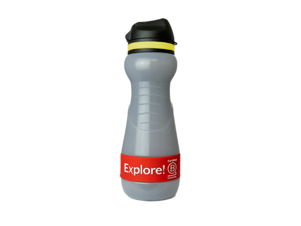 Gray water bottle with black lid and yellow band, labeled "Explore! Certified B Corporation" on a red wrap. Set against a plain white background.